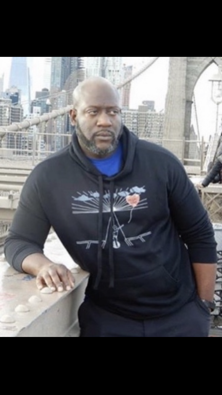 Tomike Ogugua photographed at the Brooklyn Bridge